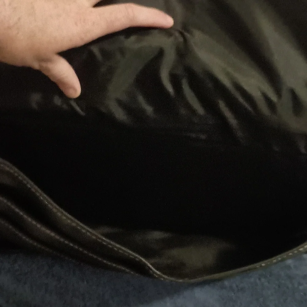 Global New Beginnings Leather laptop bag with pockets. Black bag includes strap